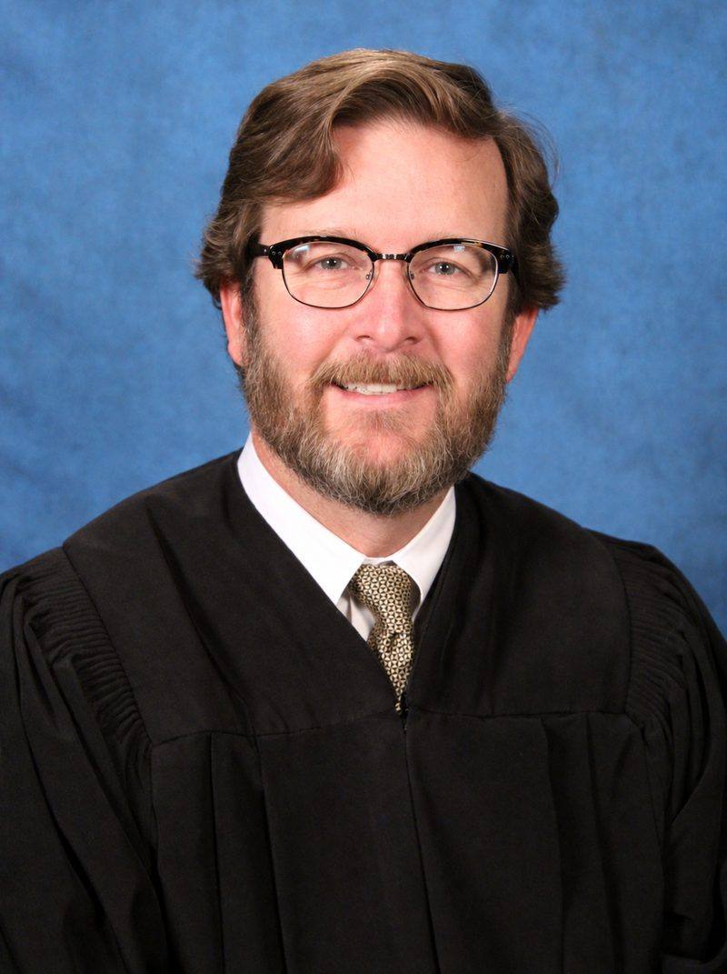 Chris Whitten in judicial robes early in his career